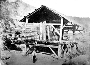 James Marshall standing in front of Sutter's Mill.