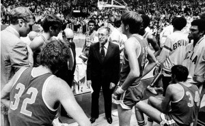 UCLA basketball coach John Wooden, center, talks to his UCLA team.