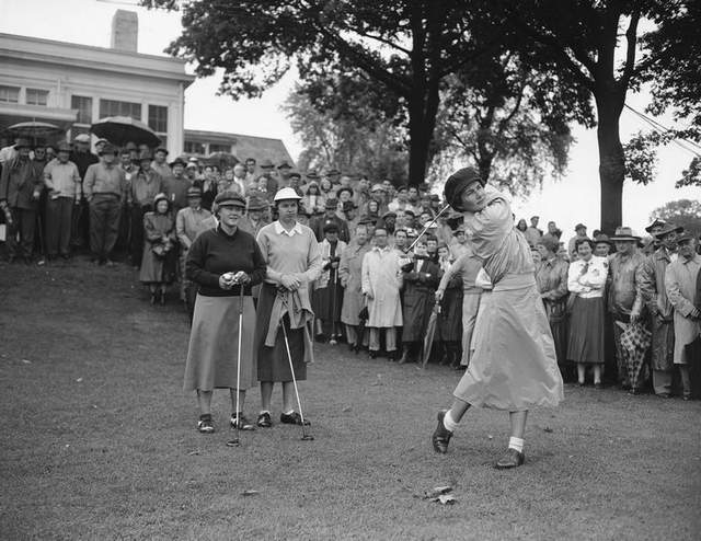 Louise Suggs tees off.