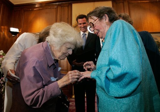Del Martin and Phyllis Lyon exchange rings as they are married by San Francisco Mayor Gavin Newsom. They were the first couple married in San Francisco as same-sex marriages become legal in California. Photograph by Marcio Jose Sanchez/AFP/Getty Images.