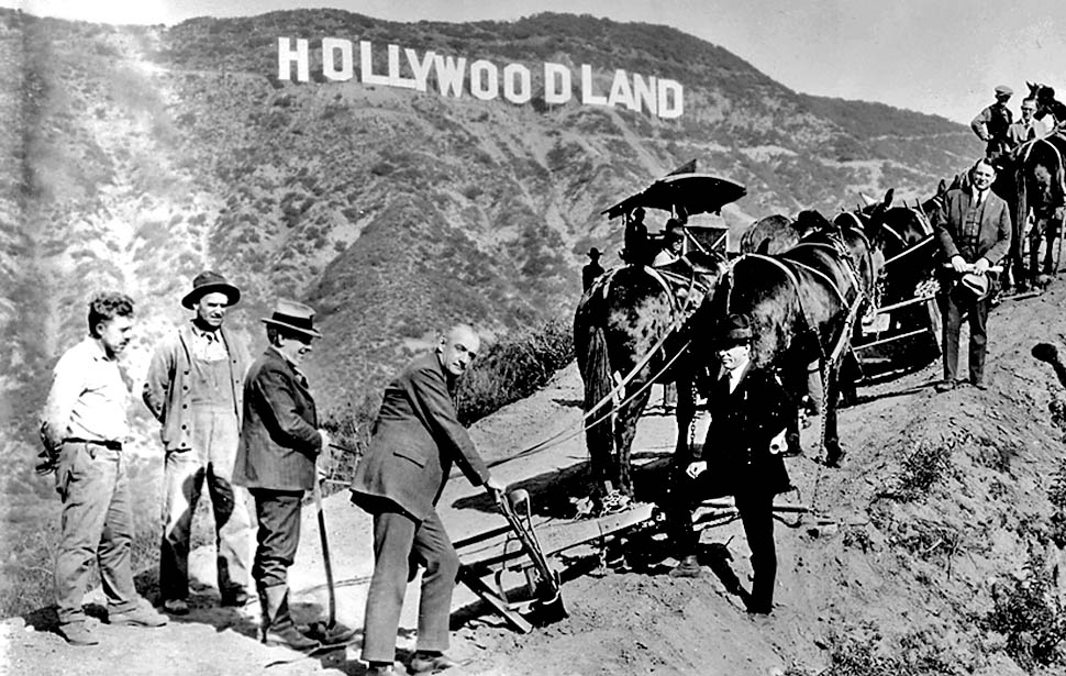 Hollywoodland subdivision groundbreaking publicity photo includes a plow, mules and surveyors.