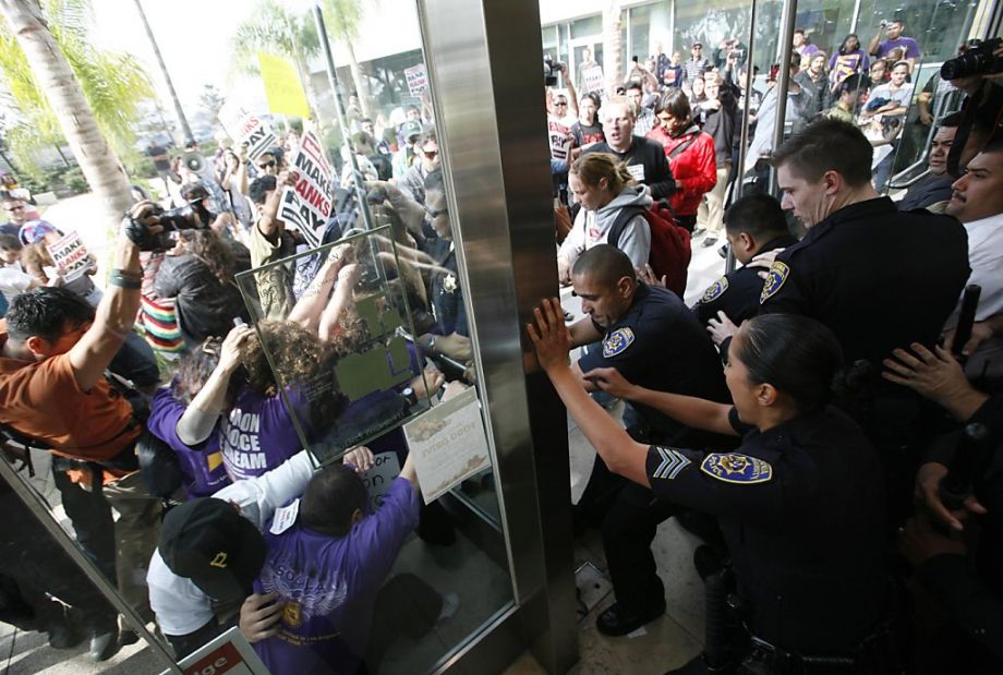 Protestors confronted California State University police after being ejected from the university's board of trustees meeting (2011).
