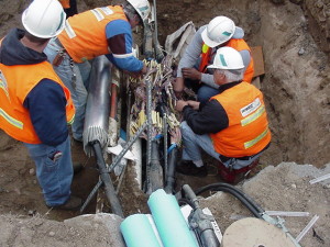 Cut fiber optic cables being repaired.