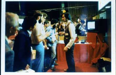 Steve Jobs showing off the first Apple II, probably at West Coast Computer Faire (1977).